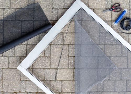 Replacing screen storm porch door Repairing screen storm porch door with new material